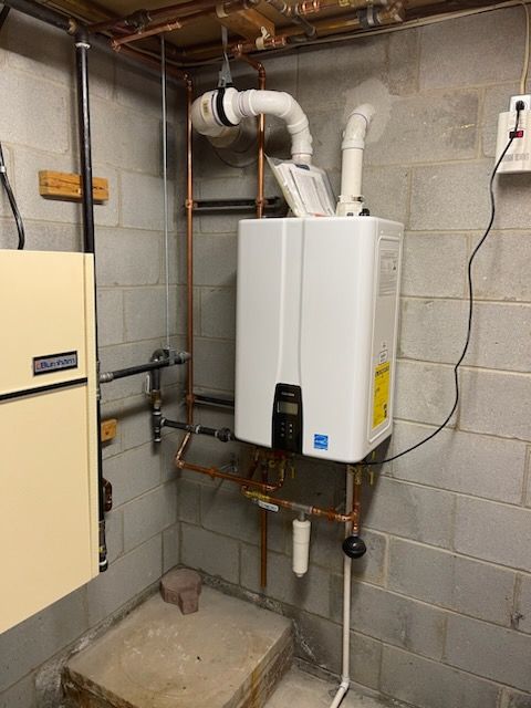 Plumber fixing the sink pipe