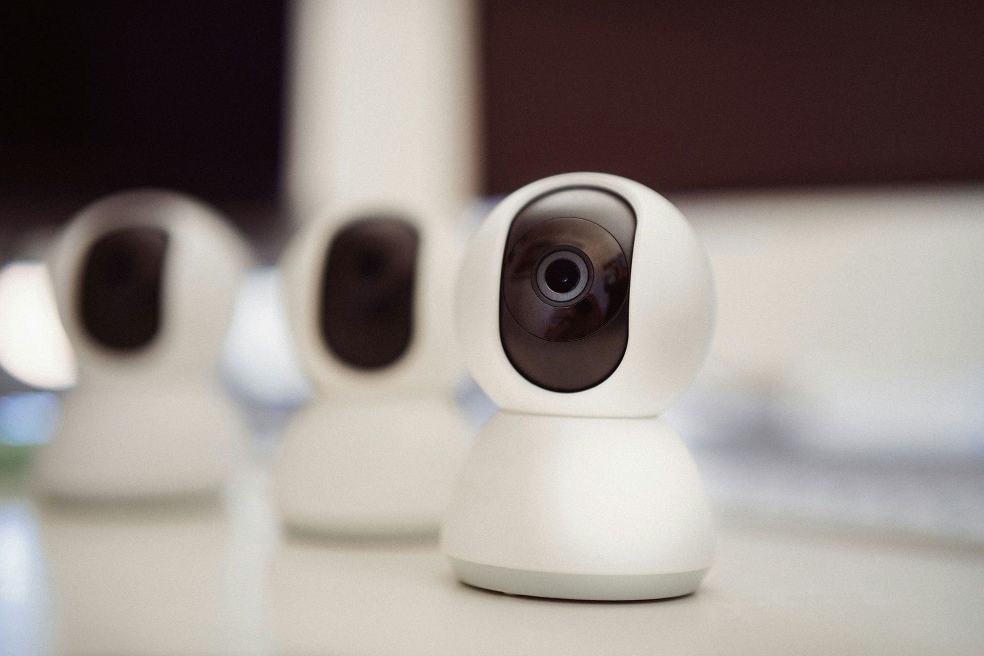 three security cameras sitting on a table