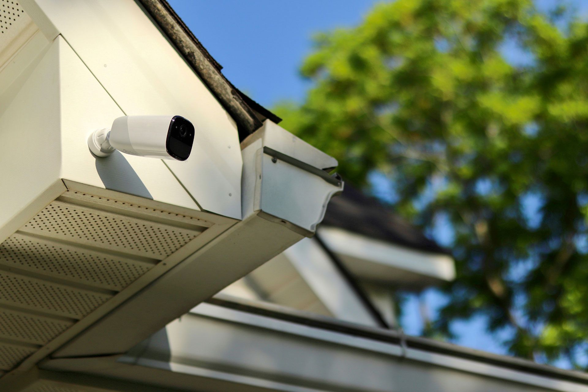 A fake outdoor security camera installed outside a home