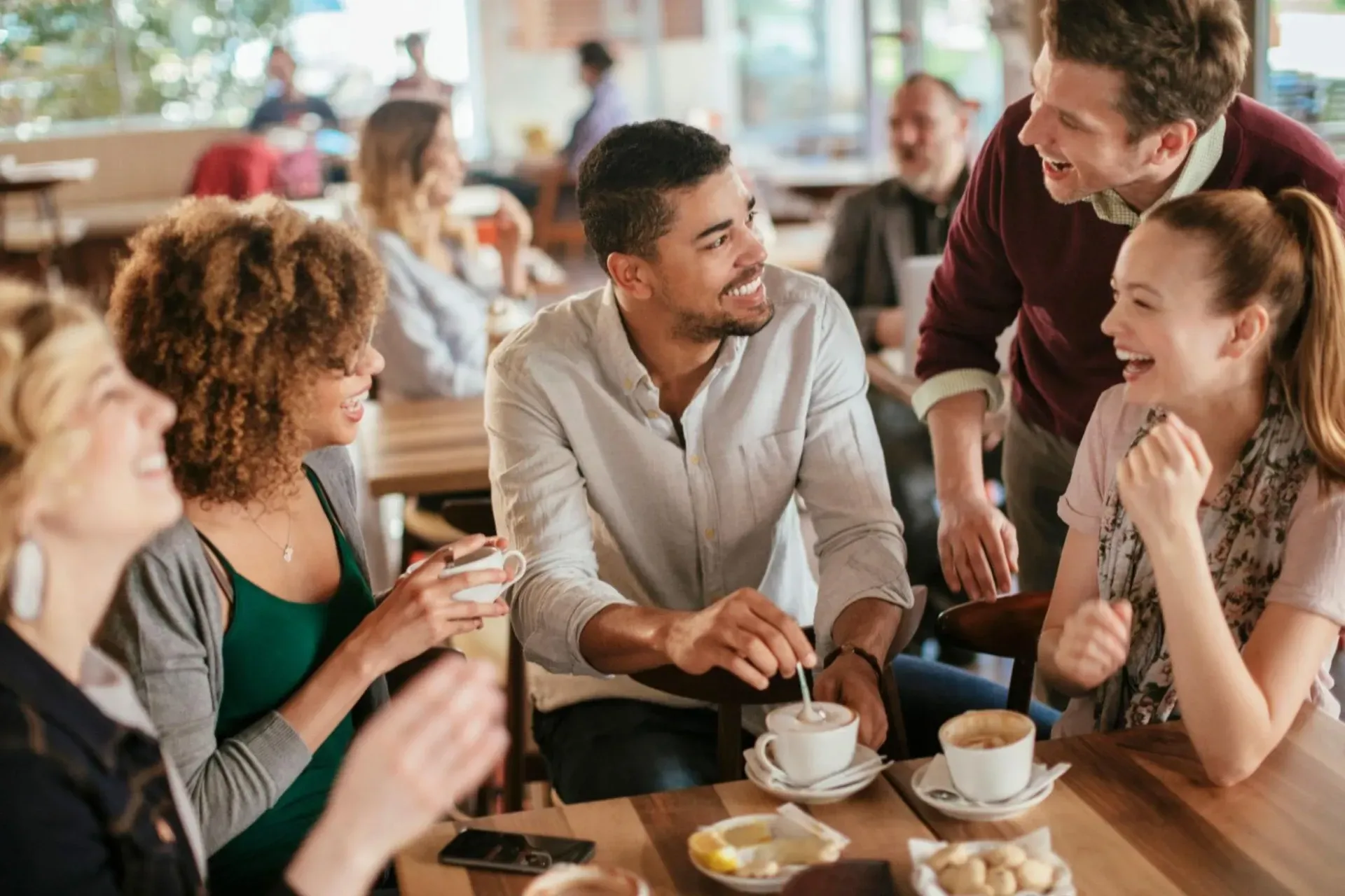 Group of Friends enjoying coffee at a local café in Burlington.