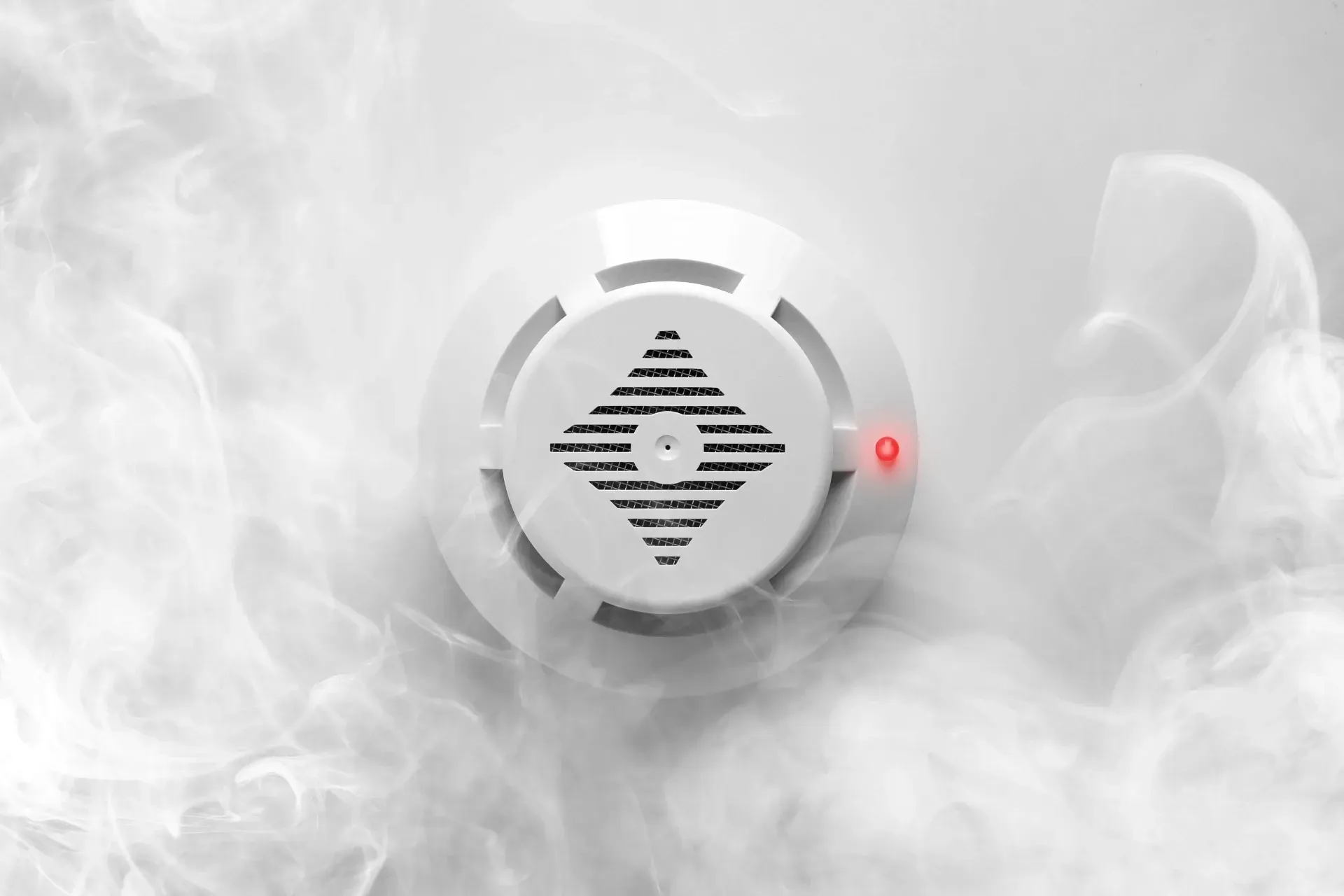 Smoke gathers around a smoke detector
