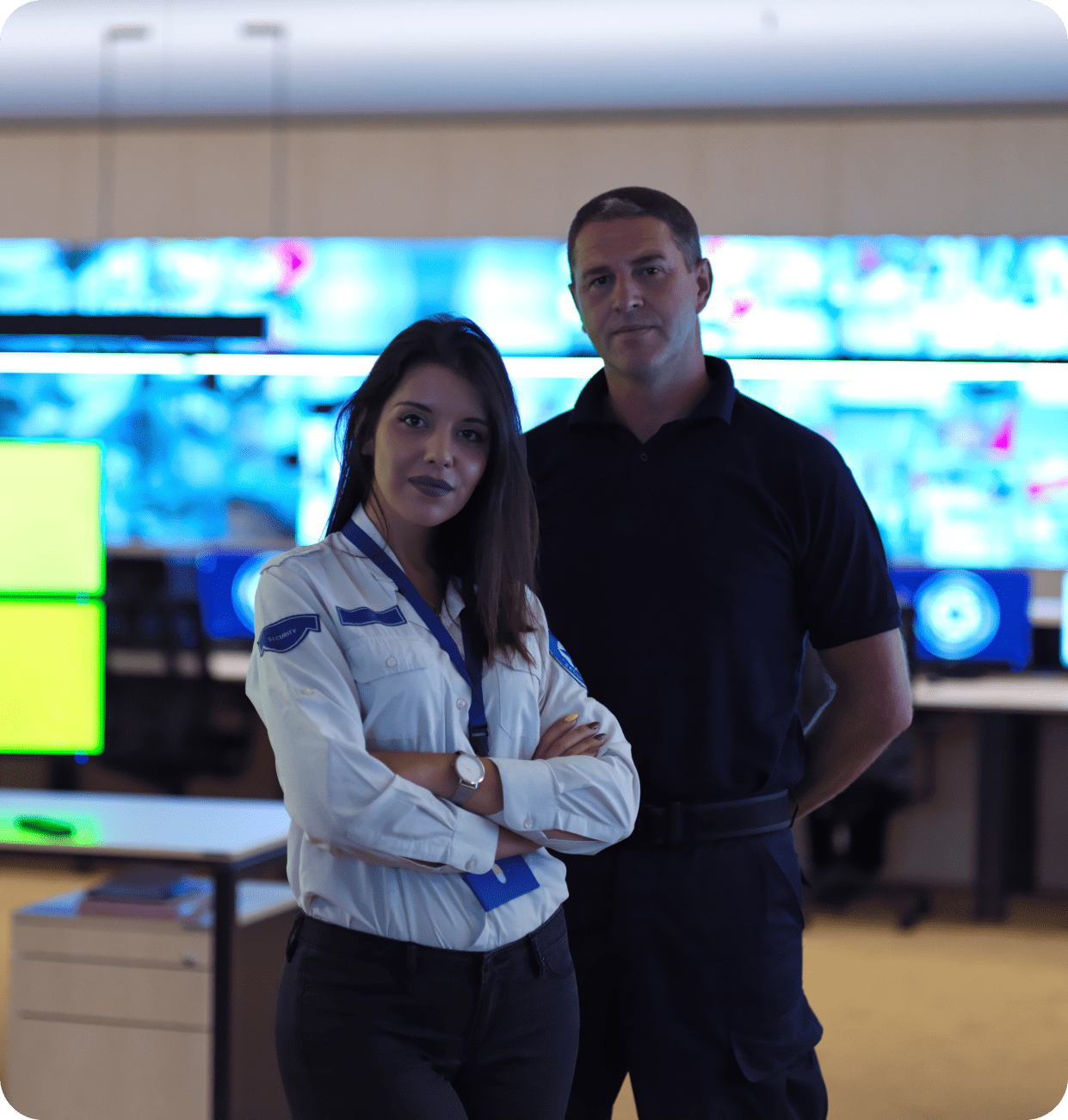 A man and a woman standing next to each other with their arms crossed