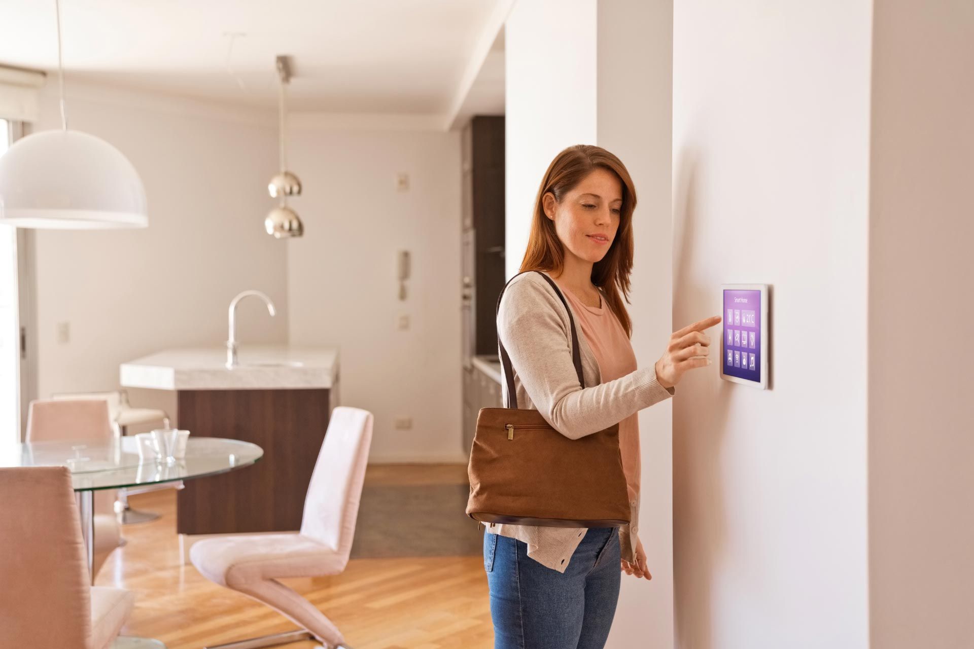 Woman checks an alarm system before her vacation