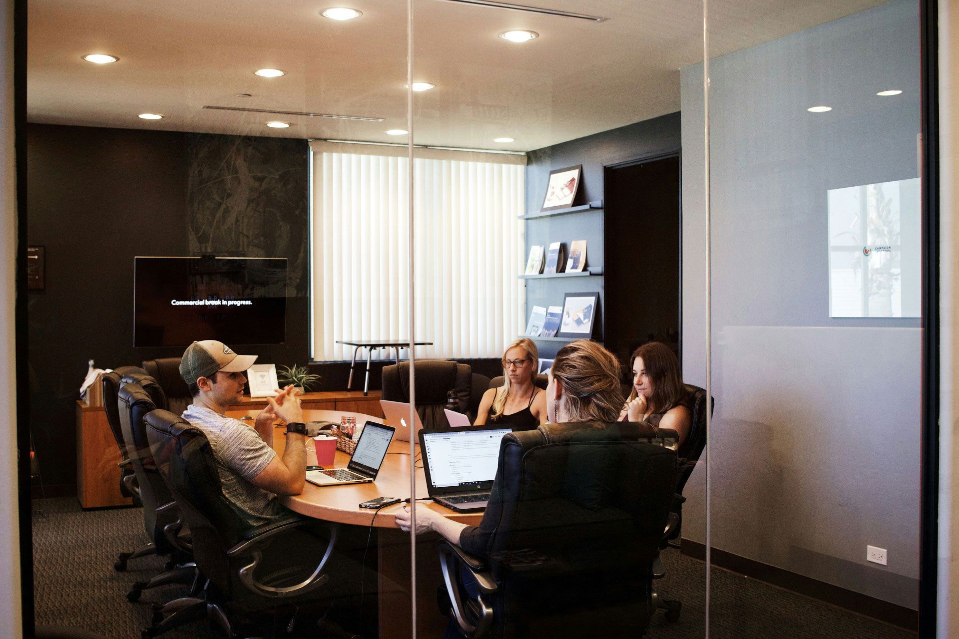 A few employees having a meeting in a conference room