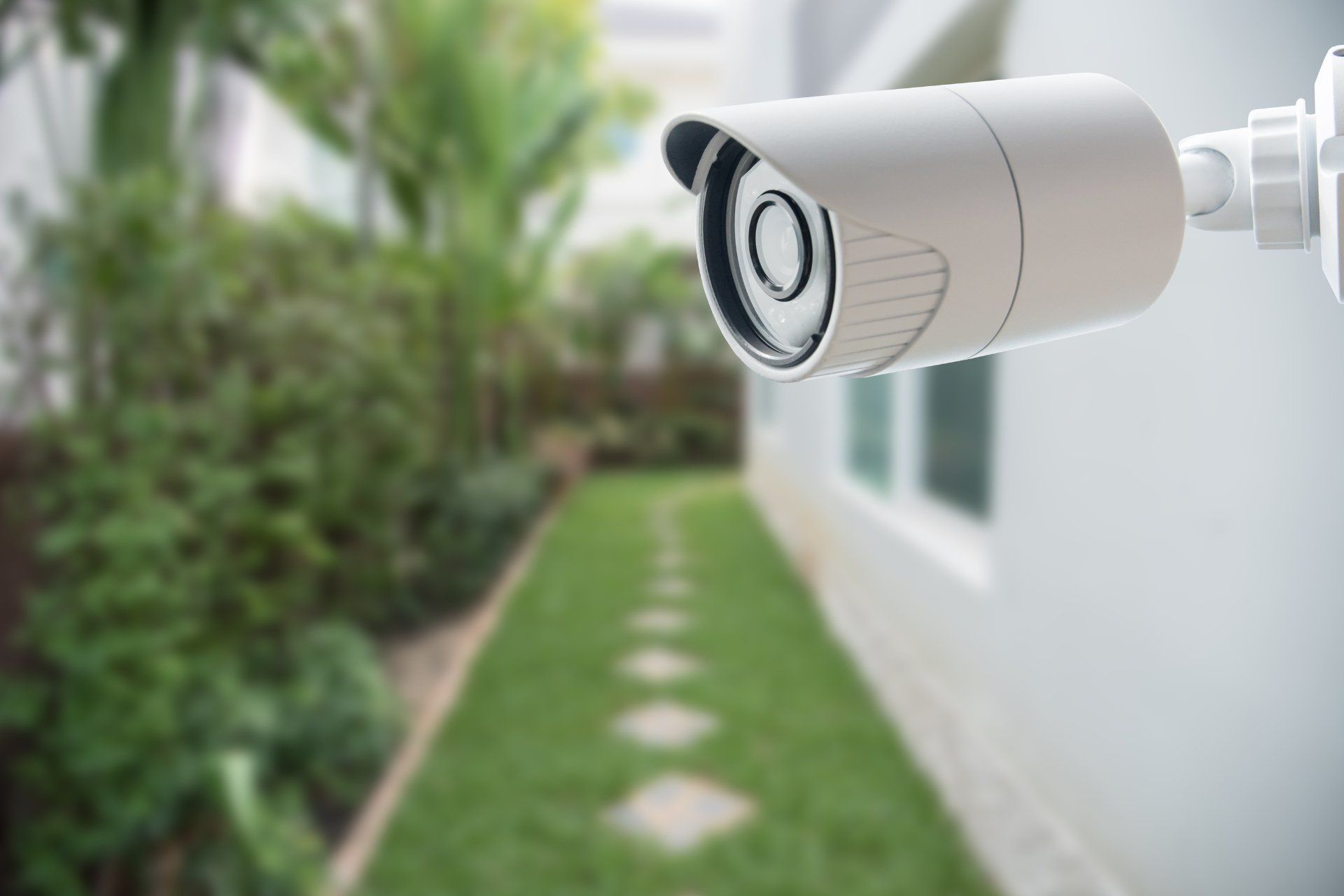 Airbnb security camera monitoring the backyard of a house.