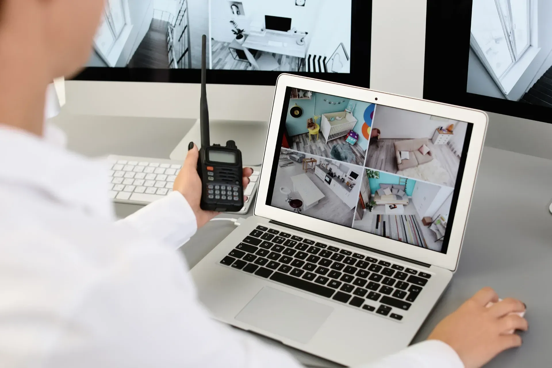 Person using a laptop to view security footage