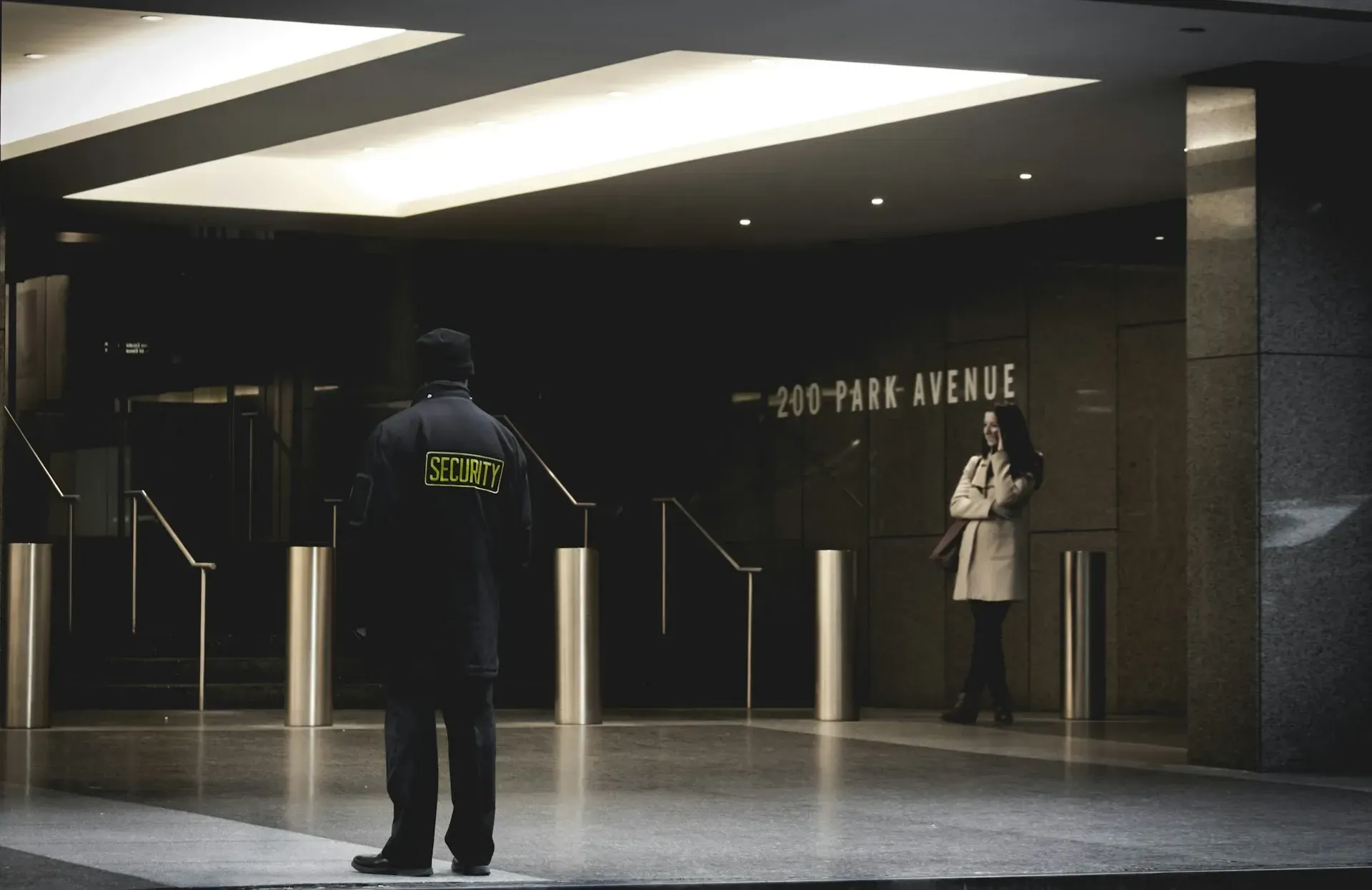 A security guard monitoring a business space for support