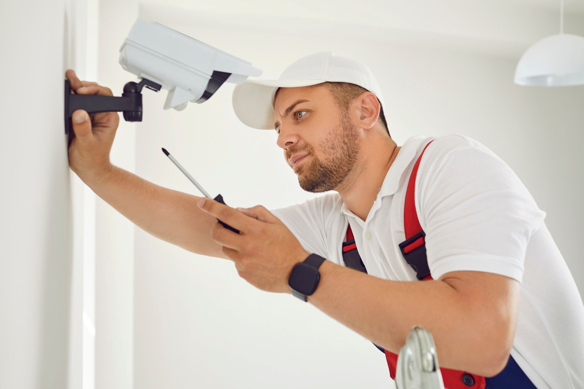 Security professional doing maintenance on the security system