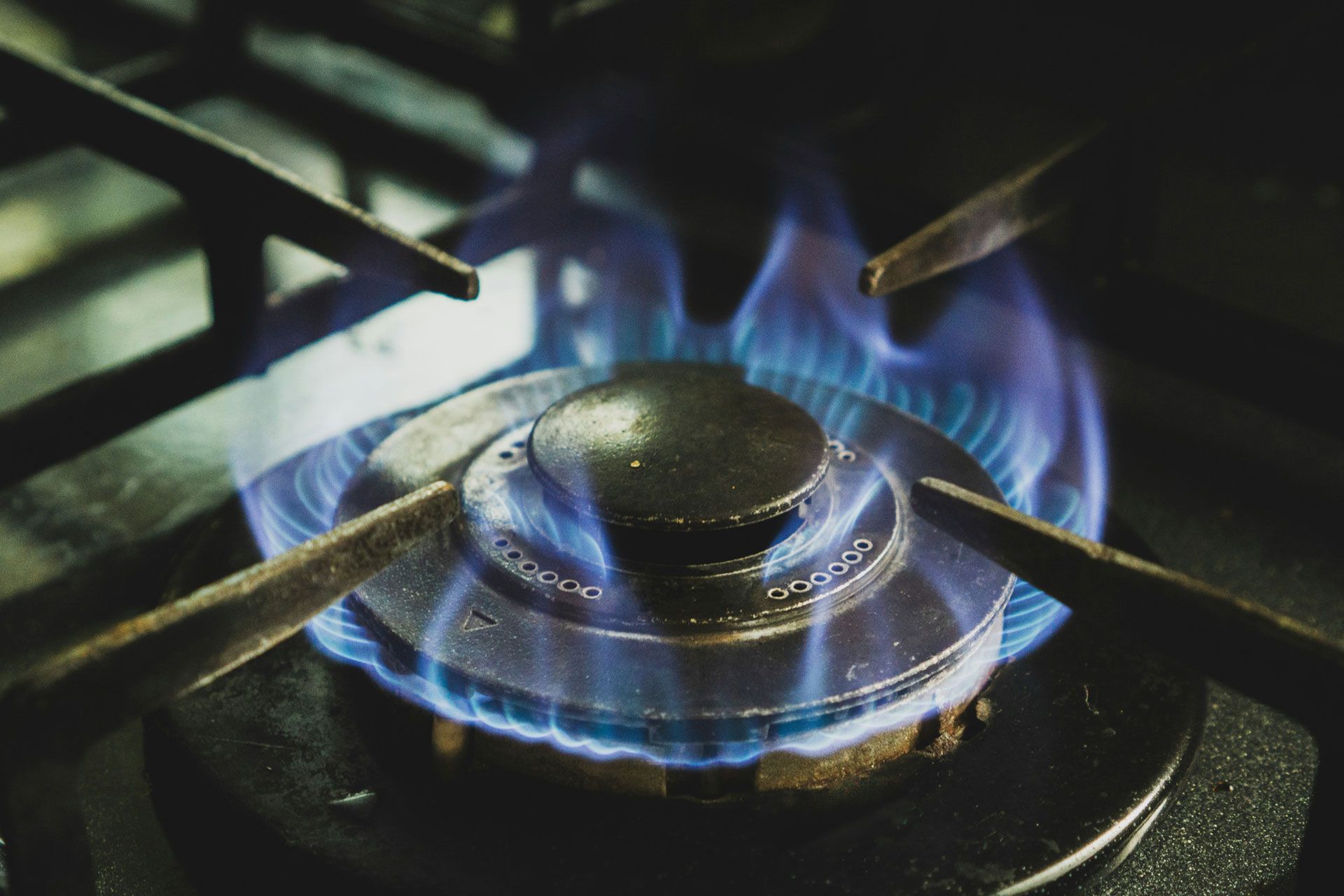 a close-up of a lit gas stove