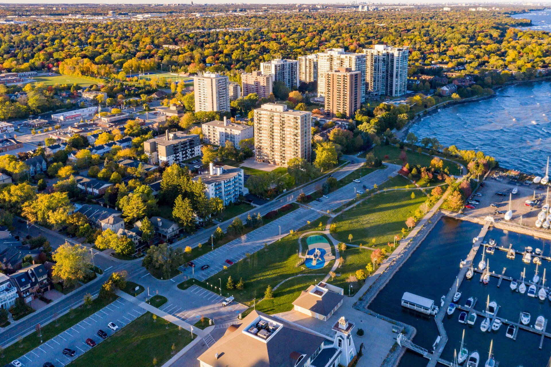 An aerial view of a city with a large body of water in the background