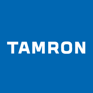The tamron logo is on a blue background.