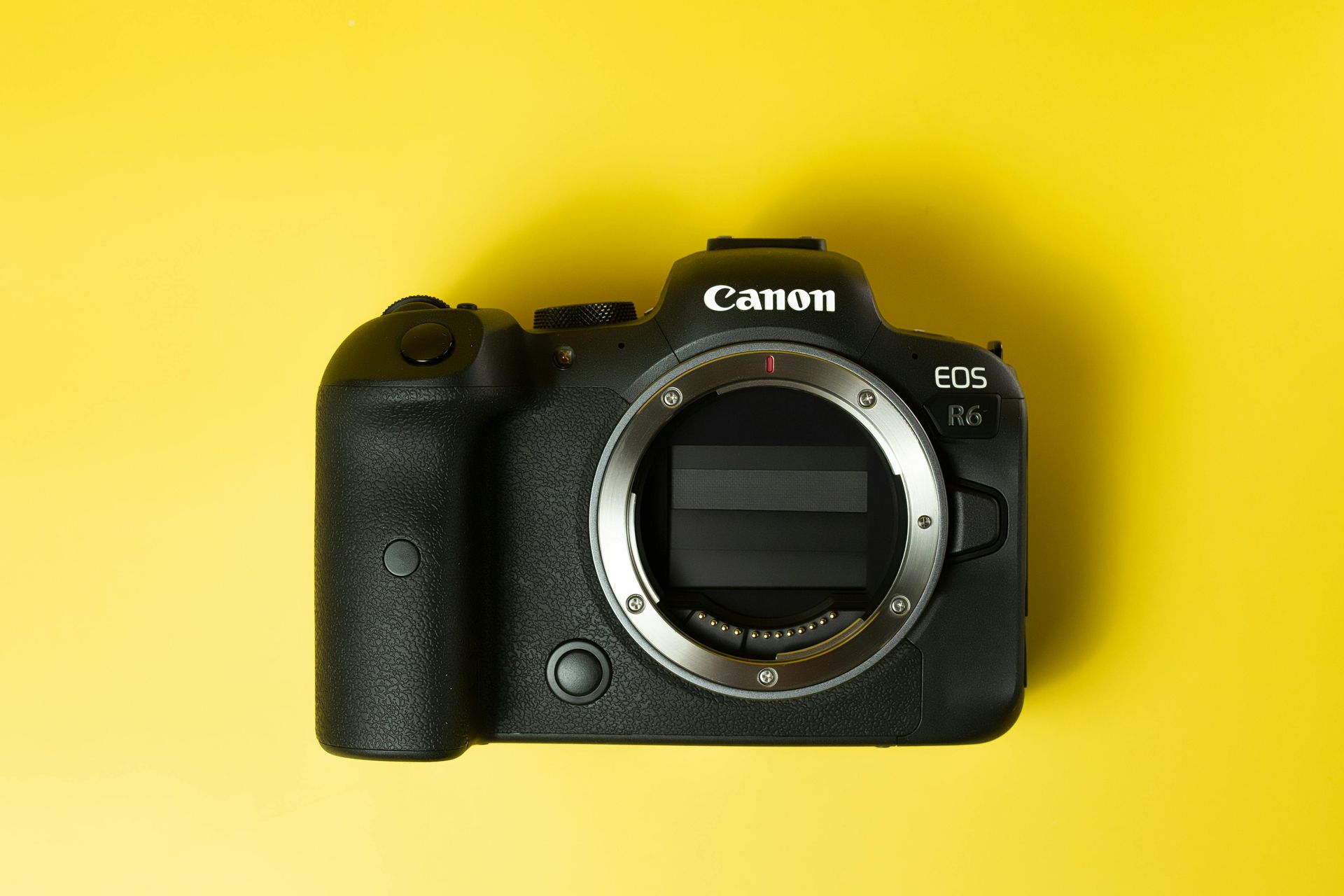 The nikon logo is on a yellow background.