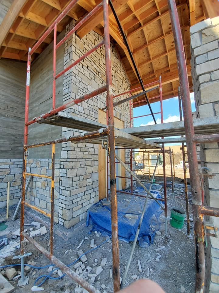 A building under construction with scaffolding around it