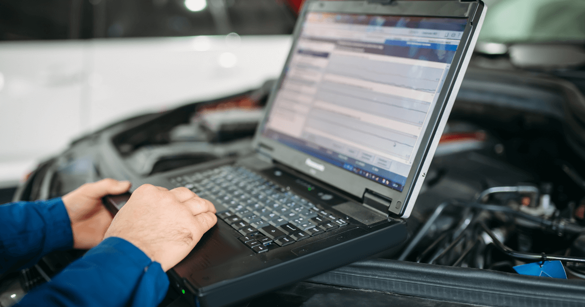 a mechanic doing a car diagnostic 