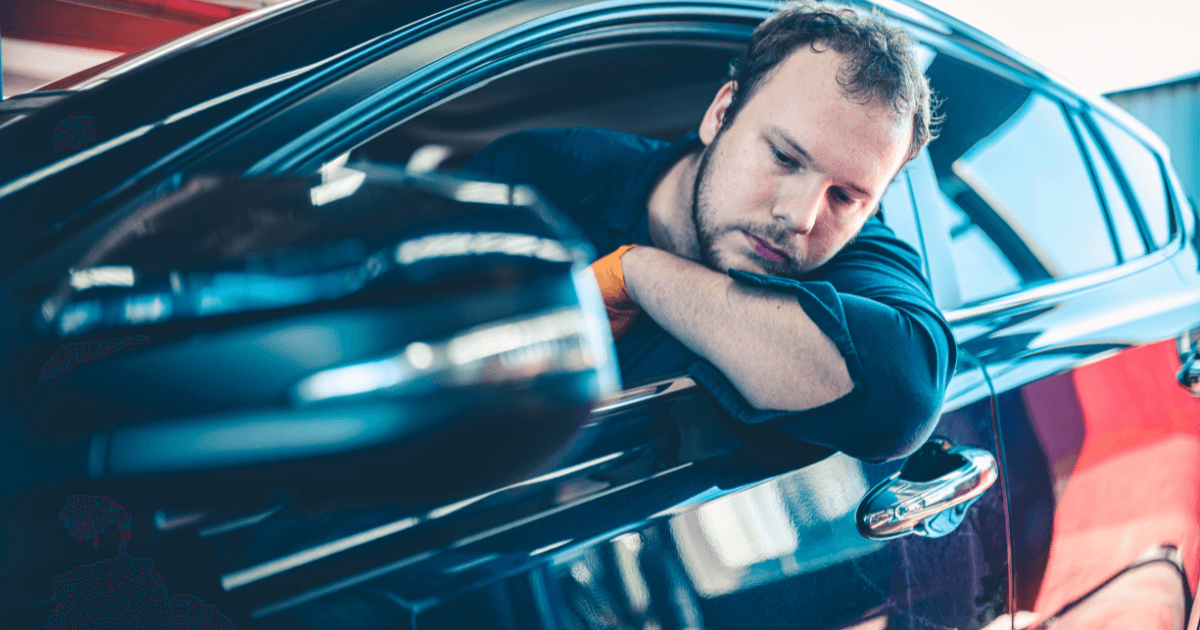 a mechanic taking a used car for a test drive