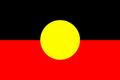 Australian Aboriginal flag: black top, red bottom, yellow sun in center.