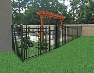A metal fence with a wooden pergola in the backyard.