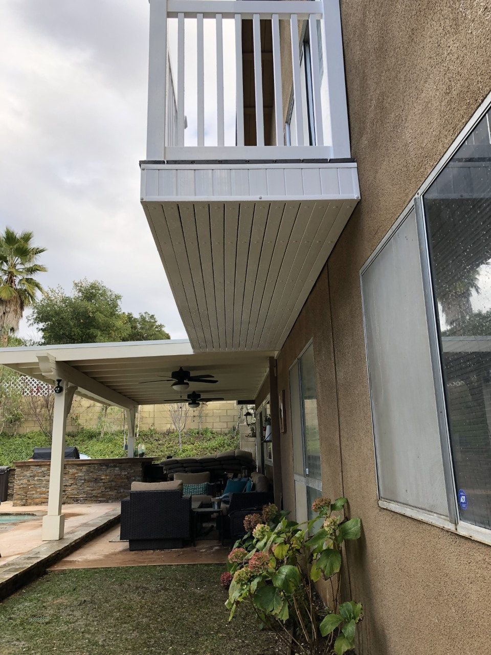 A house with a balcony on the side of it