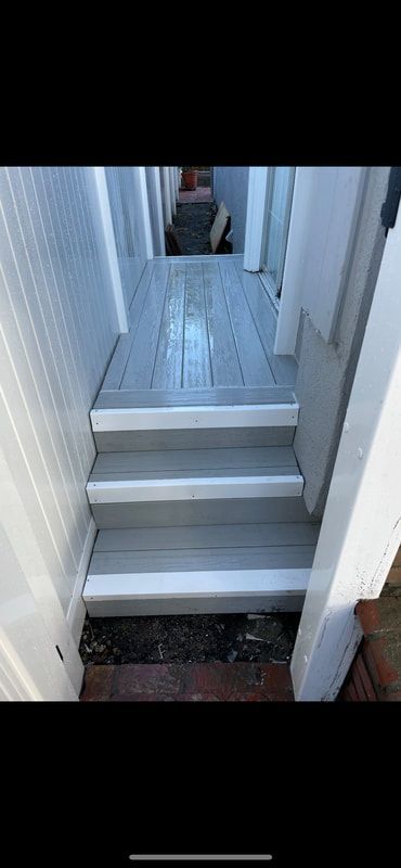 A set of stairs leading up to a house.