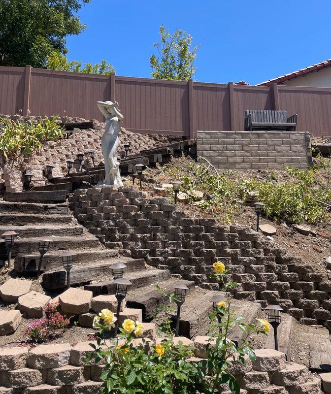 A statue of a woman standing on top of a set of stairs