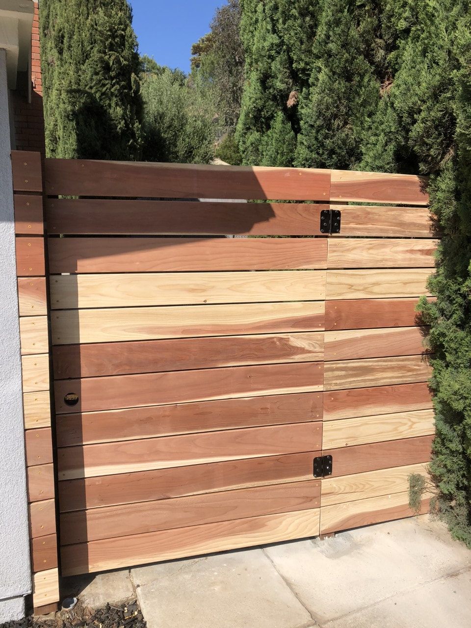 A wooden fence with trees in the background