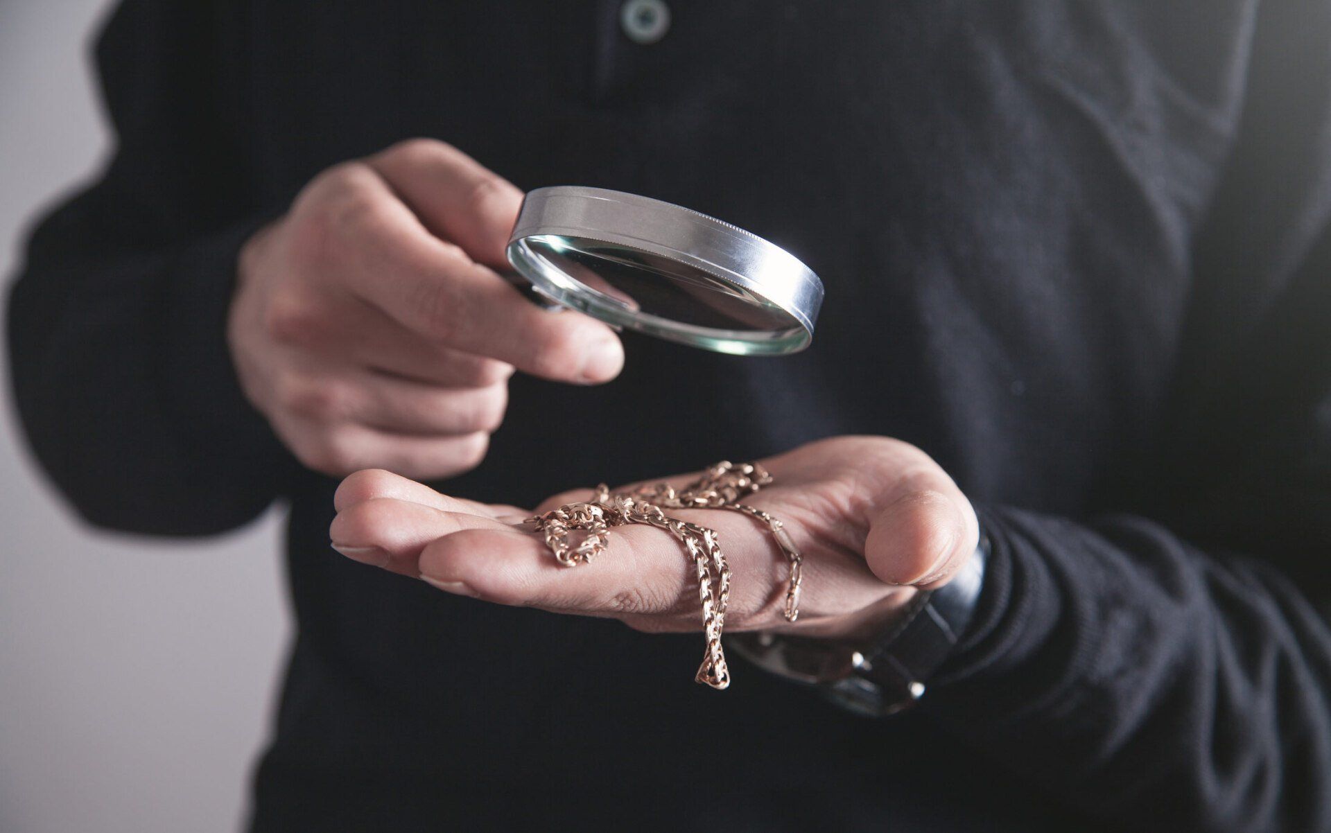Man Inspecting A Jewelry — Berkley, MI — 14K Pawn & Exchange