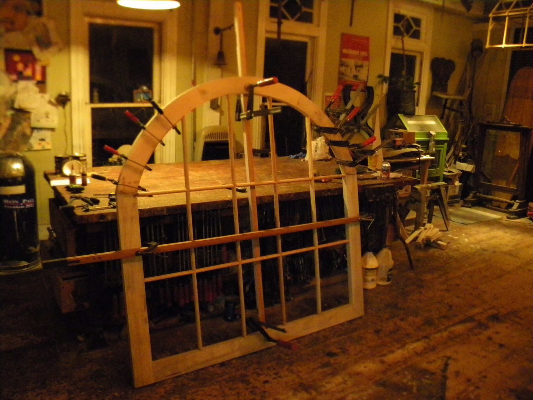 a wooden window  frame is being built in a workshop