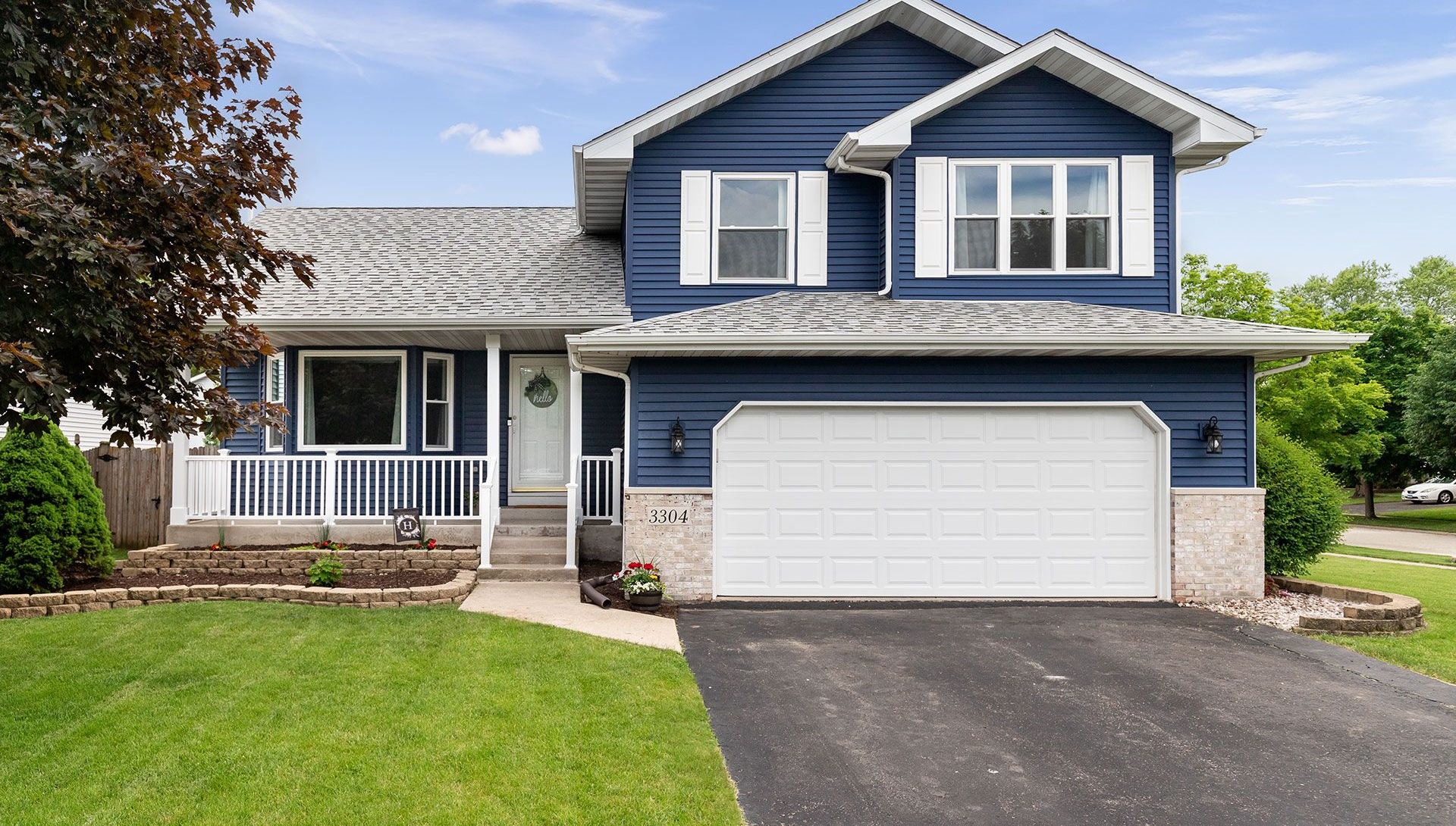 Exterior of a suburban home with blue siding