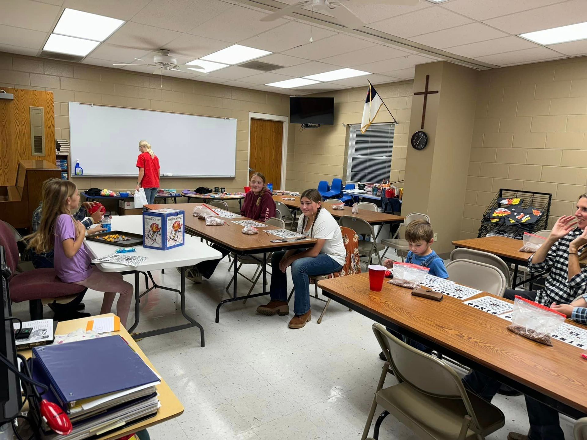 A group of people playing BINGO at Octoberfest.