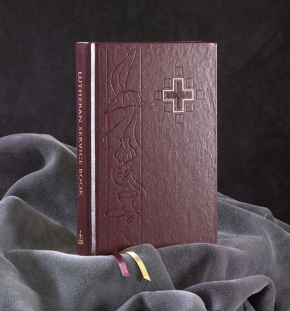 A book with a cross on the cover is titled lutheran service book