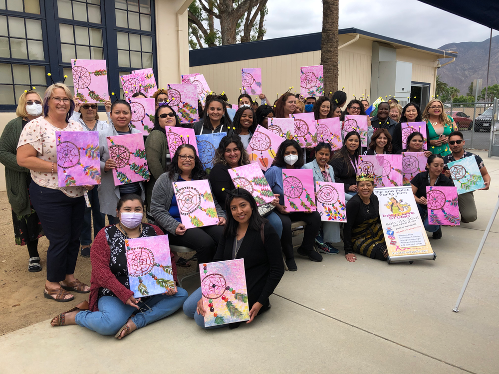 Team Holding Their Painting — Los Angeles, CA — Paint Hive Studio