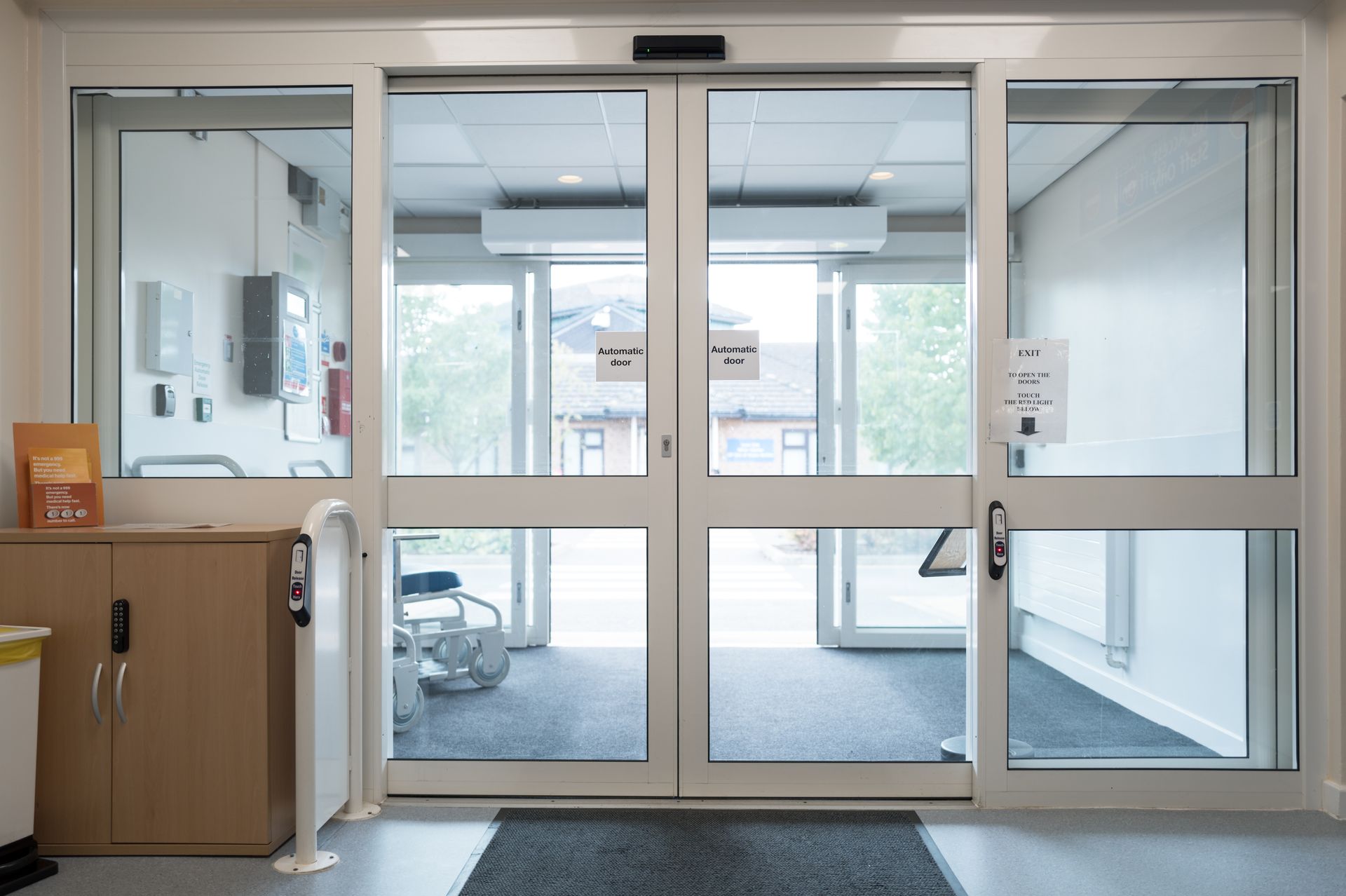 A hospital entrance with a sliding glass door