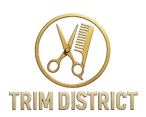 Gold scissors and comb inside a gold circle,