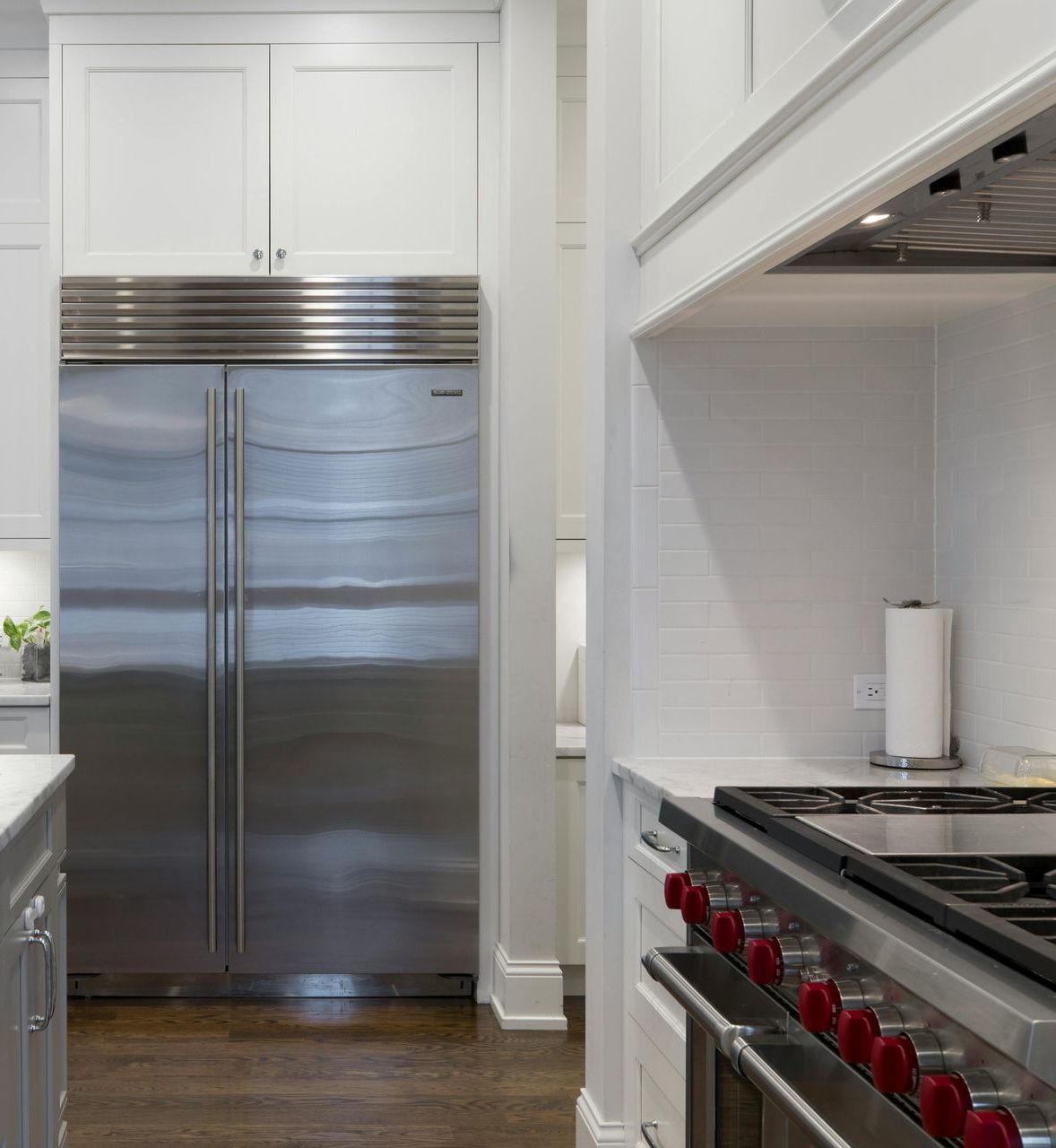A laundry room with a washer and dryer and a sink.