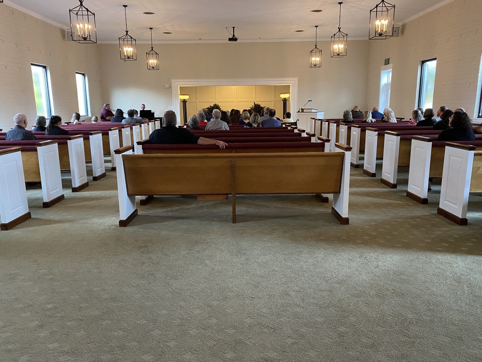 A group of people are sitting in a church.