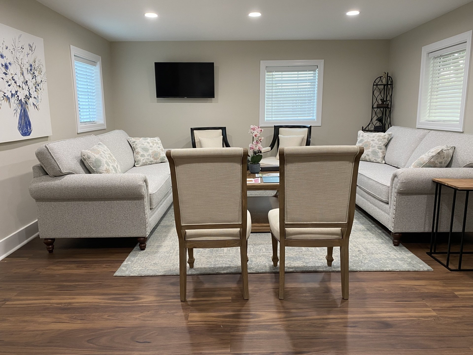 A living room filled with furniture and a flat screen tv.