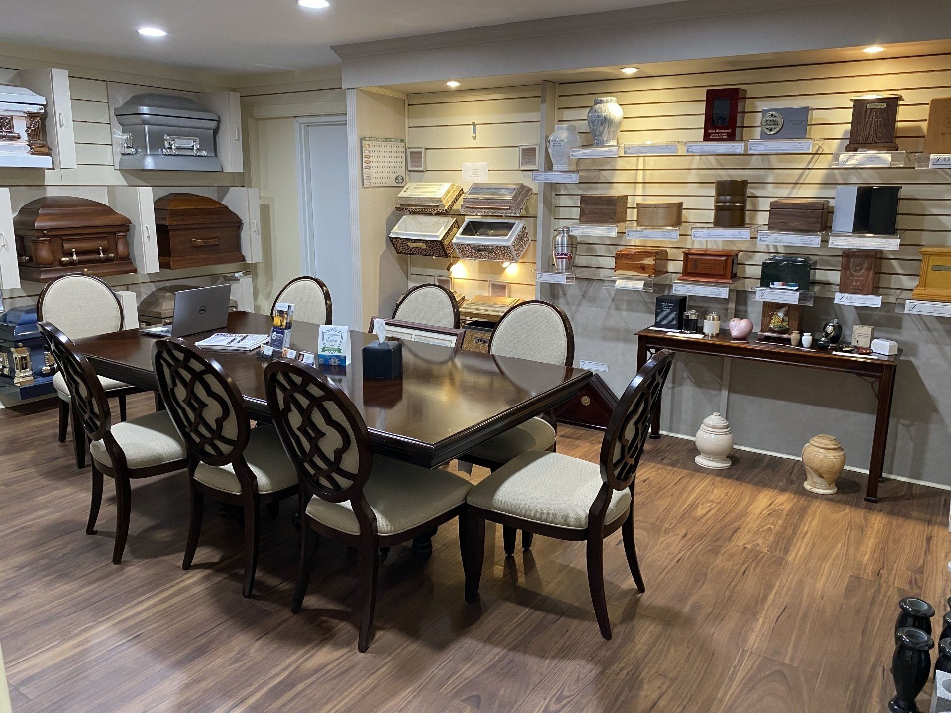 There is a table and chairs in the middle of the room.