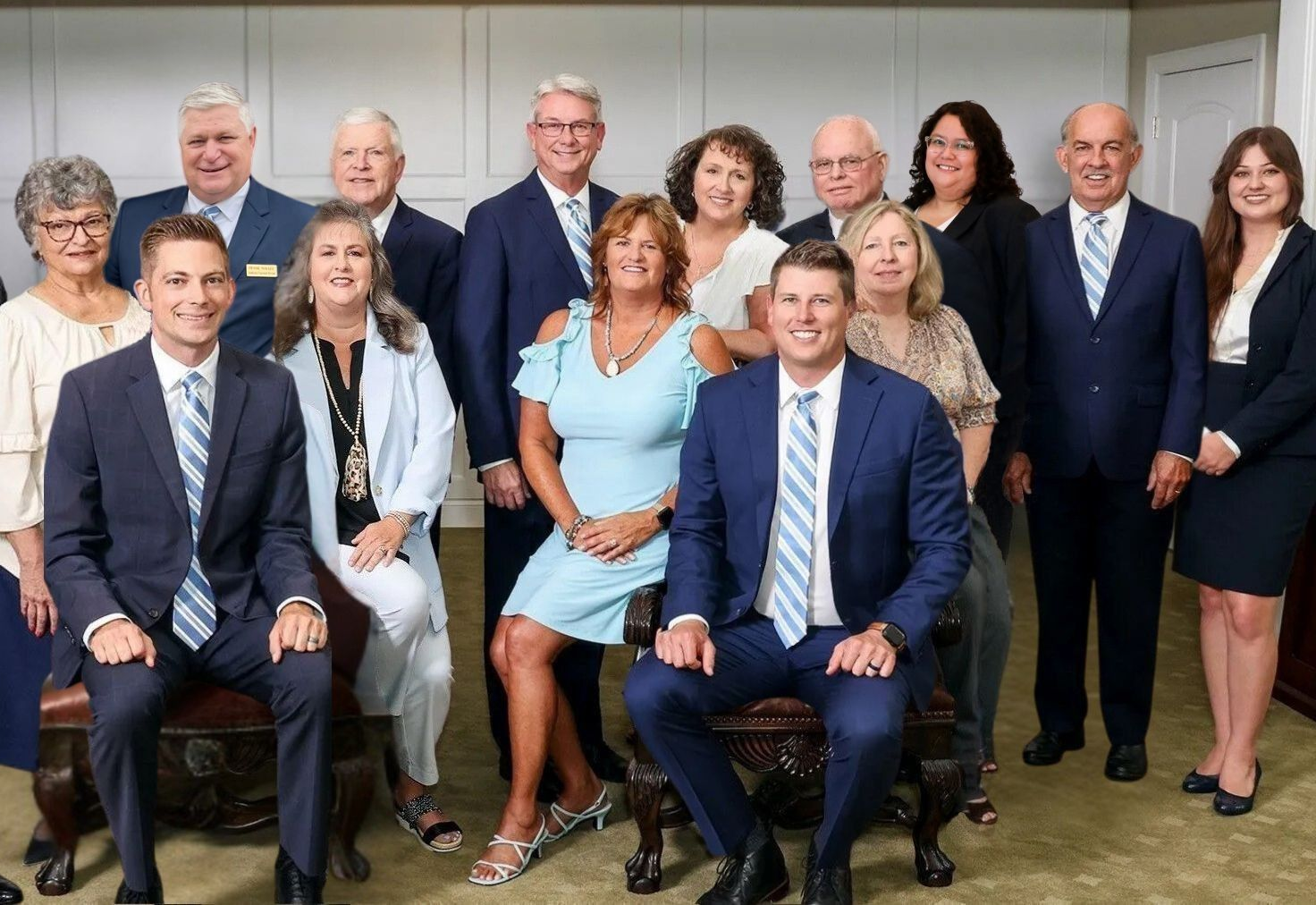 Staff members of Allen Mortuaries in front of hearse at facilities in Logan, UT 84321