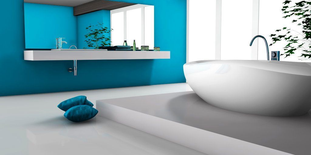 A bathroom with blue walls and a white tub