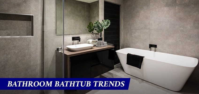 A bathroom with a bathtub , sink and mirror.