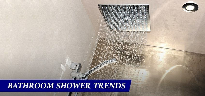 A bathroom shower with a ceiling mounted shower head.