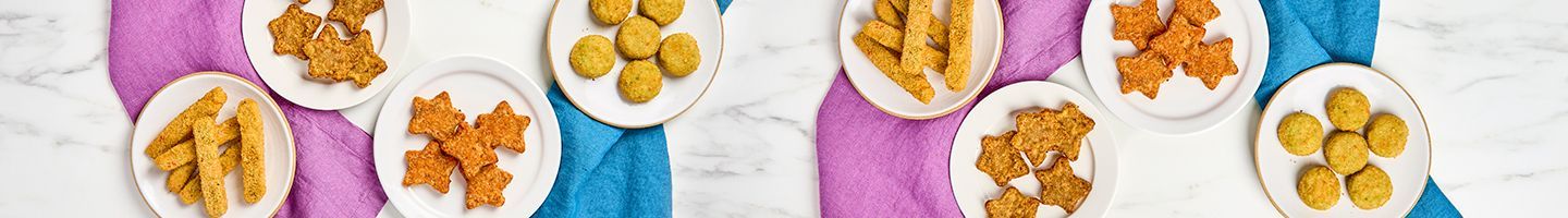 Dr Praeger's snack items arranged on plates along with colorful napkins