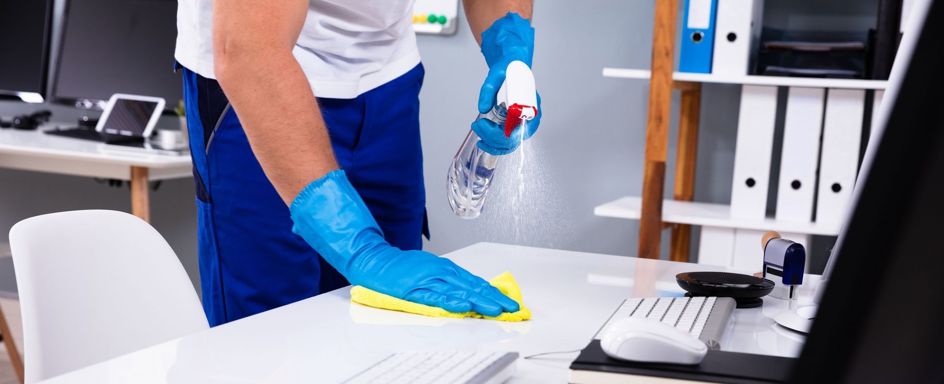 Man wiping an office table