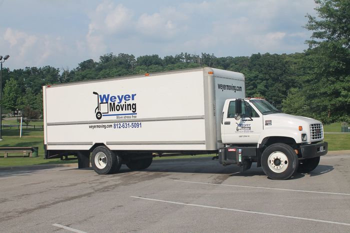 A weyer moving truck is parked in a parking lot