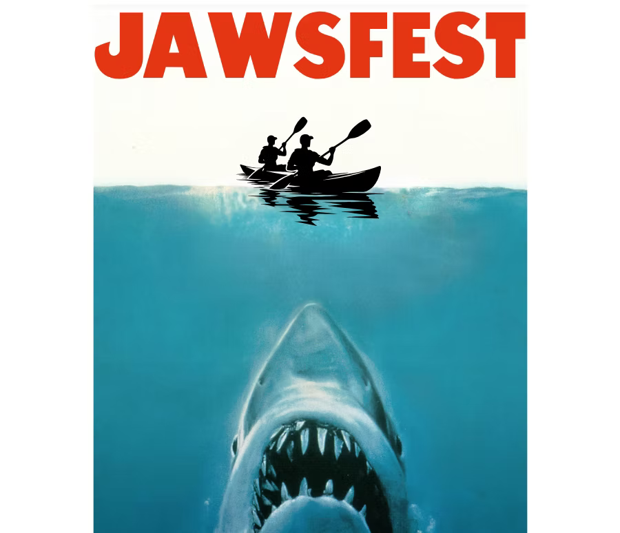 A poster for jawsfest shows a shark and two people in a kayak