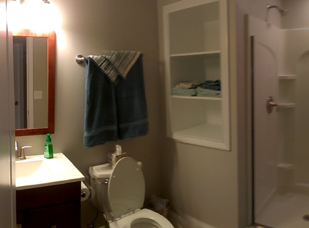 Basement baths — Green towel in white bathroom in Cincinnati, OH