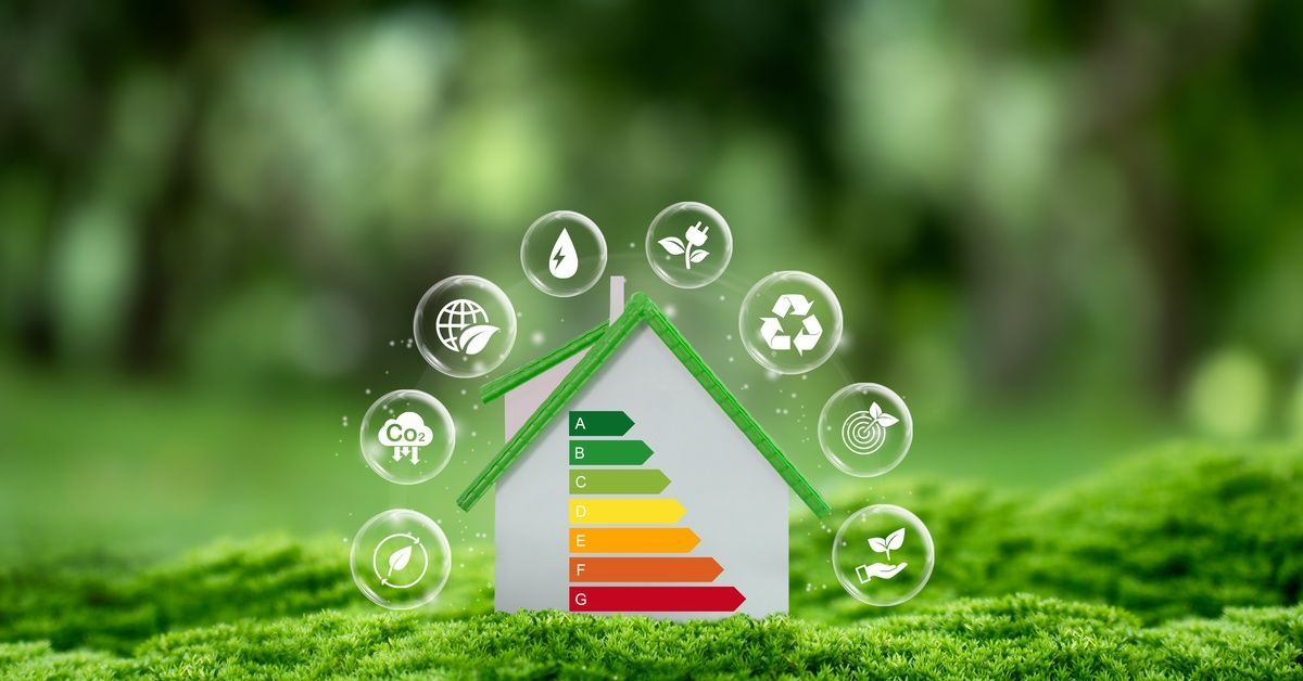 A graphic shows a small home with an energy graph from green to red arrows, surrounded by eco-friendly icons.