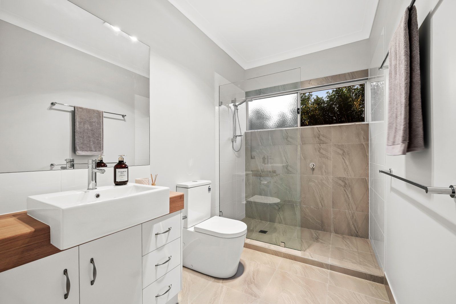 Plumber Applying Silicone Sealant Around Bathtub — Plumbers & Gasfitters in the Darling Downs