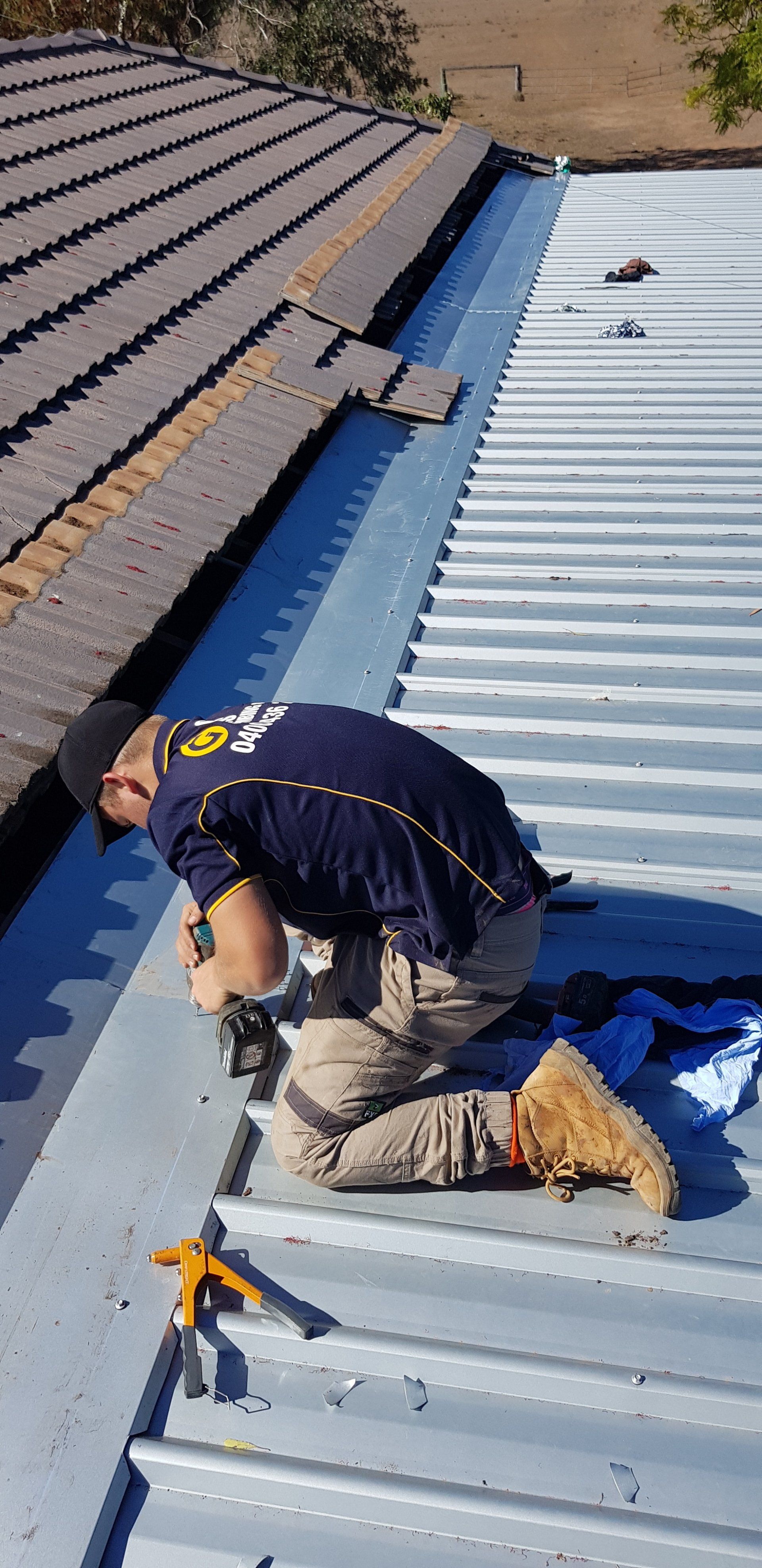 Plumber At Work In A Bathroom — Plumbers & Gasfitters in the Darling Downs