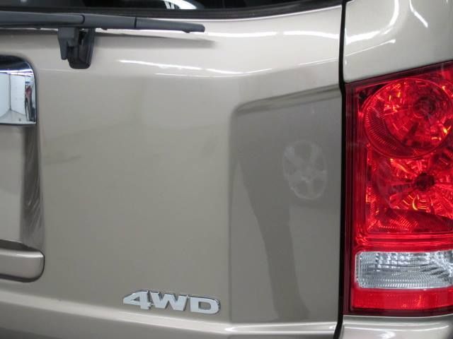 The back of a 4wd vehicle with a red tail light